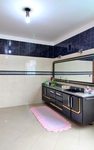 Casa à venda com 600m², 4 quartos e 6 vagasBanheiro da Suíte 1
