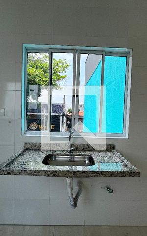 Casa de condomínio à venda com 58m², 2 quartos e 1 vagaCozinha e Área de Serviço