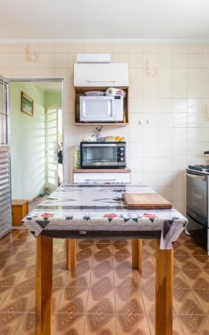 Casa à venda com 148m², 3 quartos e 2 vagas Casa à venda com 148m², 3 quartos e 2 vagasCozinha