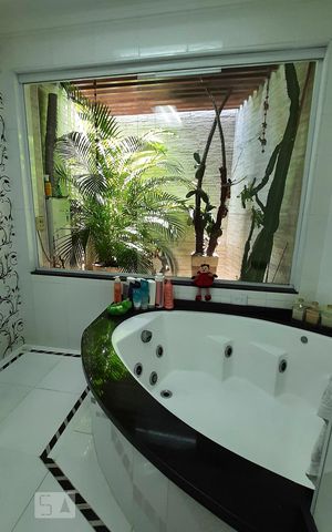 Casa à venda com 350m², 4 quartos e 4 vagasBanheiro Suite 1