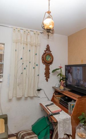 Casa à venda com 105m², 3 quartos e 2 vagas Casa à venda com 105m², 3 quartos e 2 vagasSala de TV