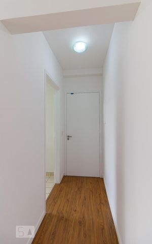 Apartamento à venda com 60m², 2 quartos e 1 vagaEntrada do apartamento e cozinha