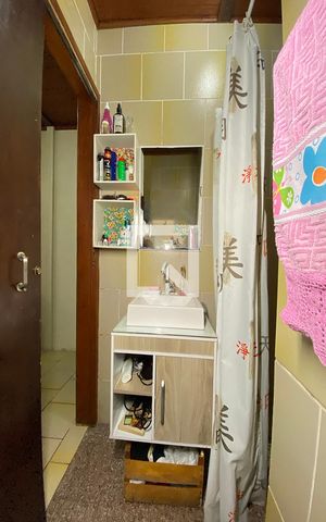 Casa à venda com 70m², 3 quartos e 2 vagasBanheiro da Suíte