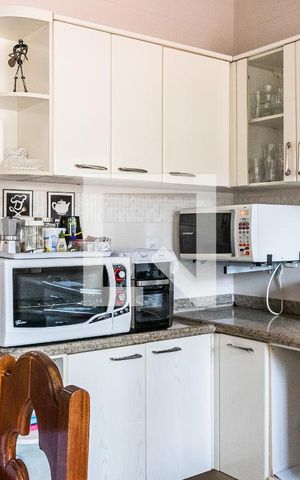 Casa à venda com 100m², 2 quartos e 2 vagas Casa à venda com 100m², 2 quartos e 2 vagasCozinha