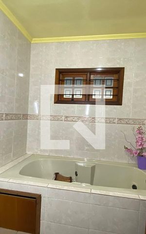 Casa à venda com 411m², 4 quartos e 3 vagasBanheiro da Suíte 3