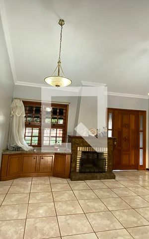 Casa à venda com 411m², 4 quartos e 3 vagasSala