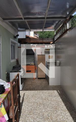 Casa à venda com 247m², 4 quartos e 4 vagasTraseira da Casa com Churrasqueira