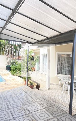 Casa de condomínio à venda com 420m², 4 quartos e 4 vagasChurrasqueira