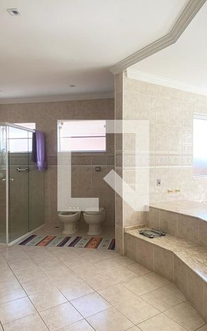 Casa de condomínio à venda com 420m², 4 quartos e 4 vagasBanheiro da Suíte master