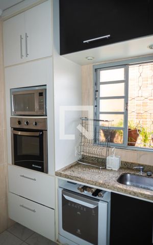 Casa à venda com 125m², 2 quartos e 2 vagas Casa à venda com 125m², 2 quartos e 2 vagasCozinha