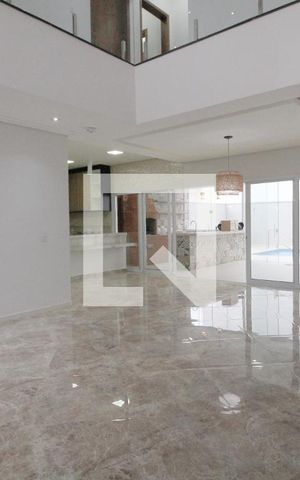 Casa de condomínio para alugar com 450m², 4 quartos e 5 vagasSala