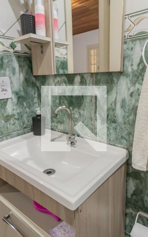 Casa à venda com 98m², 3 quartos e 2 vagasBanheiro do Quarto 1