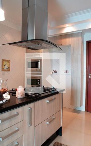 Casa de condomínio para alugar com 300m², 3 quartos e 4 vagasCozinha