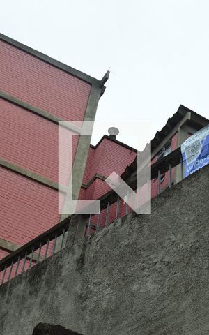 Apartamento à venda com 60m², 2 quartos e 1 vagaPlaquinha instalada na fachada do condomínio