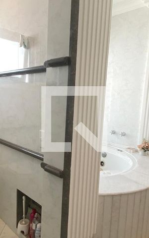 Casa de condomínio à venda com 462m², 4 quartos e 4 vagasBanheiro da Suíte 1