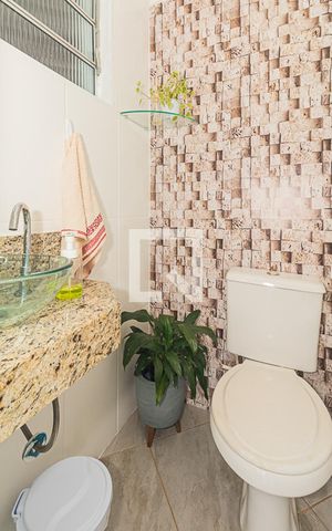 Casa à venda com 207m², 3 quartos e 2 vagas Casa à venda com 207m², 3 quartos e 2 vagasBanheiro do Espaço Gourmet
