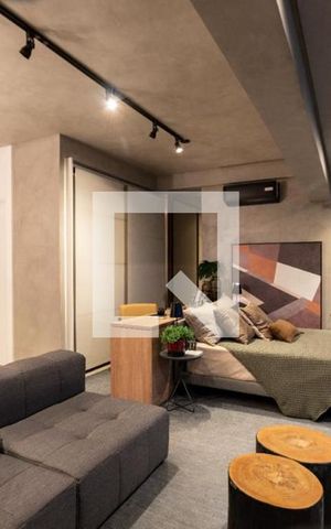 Studio à venda com 39m², 1 quarto e 1 vaga Studio à venda com 39m², 1 quarto e 1 vagaDetalhe - ambiente de estar e cama de casal