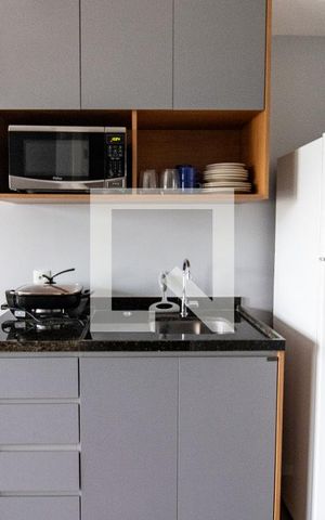 Studio à venda com 27m², 1 quarto e sem vaga Studio à venda com 27m², 1 quarto e sem vagaCozinha- detalhe armários e geladeira