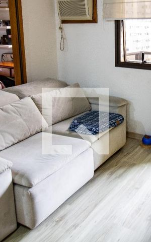 Studio à venda com 37m², 1 quarto e 1 vagaSala- sofá e rack de TV