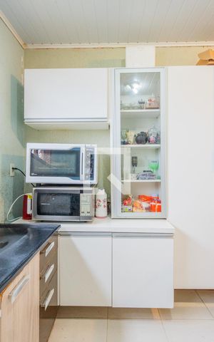 Casa à venda com 50m², 2 quartos e sem vaga Casa à venda com 50m², 2 quartos e sem vagaCozinha e Área de Serviço