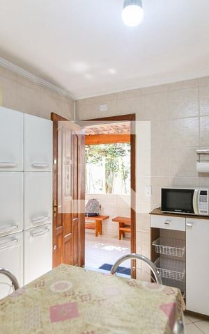 Casa à venda com 63m², 2 quartos e 2 vagas Casa à venda com 63m², 2 quartos e 2 vagasCozinha