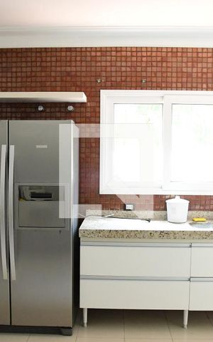 Casa de condomínio para alugar com 582m², 4 quartos e 4 vagasCozinha