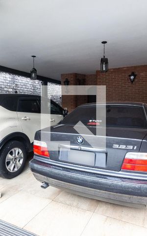 Casa de condomínio à venda com 400m², 4 quartos e 4 vagas Casa de condomínio à venda com 400m², 4 quartos e 4 vagasGaragem