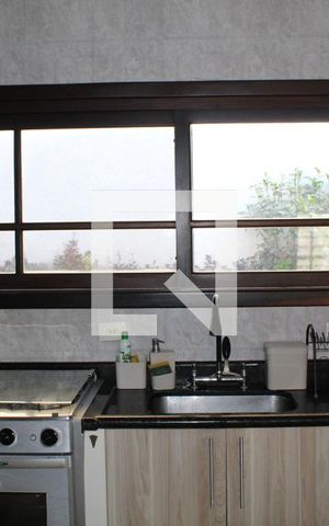 Casa de condomínio para alugar com 450m², 3 quartos e 5 vagasCozinha