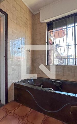 Casa à venda com 405m², 4 quartos e 4 vagasBanheiro Suíte 