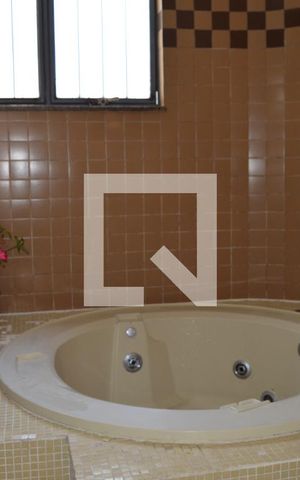 Casa à venda com 419m², 4 quartos e 4 vagasBanheiro da Suite