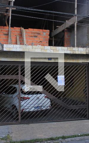 Casa à venda com 145m², 3 quartos e 2 vagasFachada com placa QuintoAndar