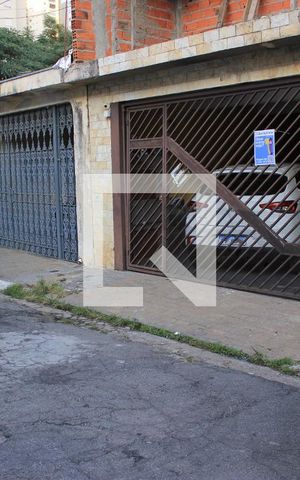 Casa à venda com 145m², 3 quartos e 2 vagasFachada com placa QuintoAndar