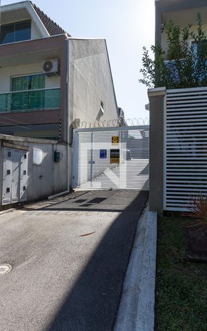 Casa de condomínio para alugar com 164m², 3 quartos e 2 vagasEntrada da garagem - plaquinha