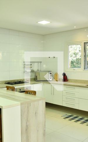Casa de condomínio para alugar com 370m², 4 quartos e 6 vagasCozinha