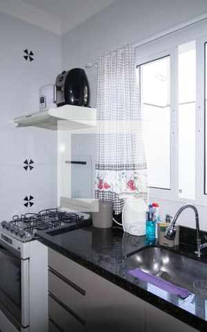 Casa à venda com 80m², 2 quartos e 3 vagas Casa à venda com 80m², 2 quartos e 3 vagasSala e Cozinha