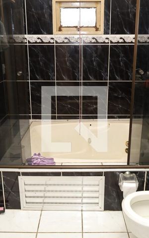 Casa à venda com 440m², 4 quartos e 4 vagasBanheiro