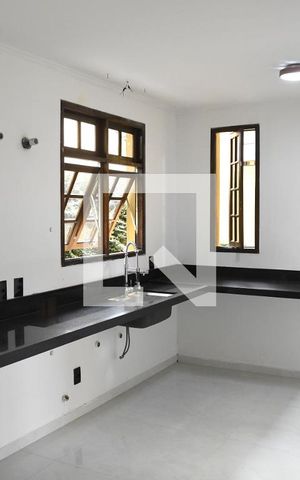 Casa de condomínio para alugar com 285m², 6 quartos e 4 vagasCozinha