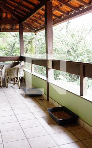 Casa de condomínio para alugar com 460m², 4 quartos e 2 vagasVaranda - Sala