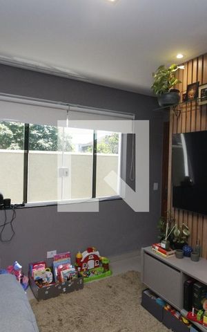 Casa de condomínio à venda com 68m², 2 quartos e 2 vagasSala de TV
