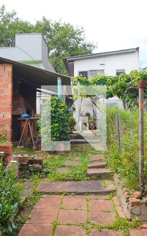 Casa à venda com 100m², 2 quartos e 2 vagasFachada Fundos