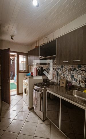 Casa à venda com 58m², 2 quartos e 2 vagas Casa à venda com 58m², 2 quartos e 2 vagasCozinha