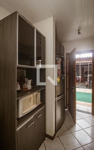 Casa à venda com 58m², 2 quartos e 2 vagas Casa à venda com 58m², 2 quartos e 2 vagasCozinha