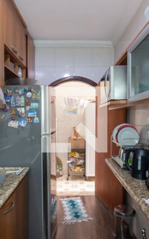 Casa à venda com 54m², 2 quartos e 2 vagas Casa à venda com 54m², 2 quartos e 2 vagasCozinha