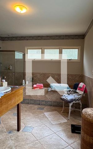 Casa de condomínio à venda com 450m², 4 quartos e 6 vagasBanheiro da Suíte 1