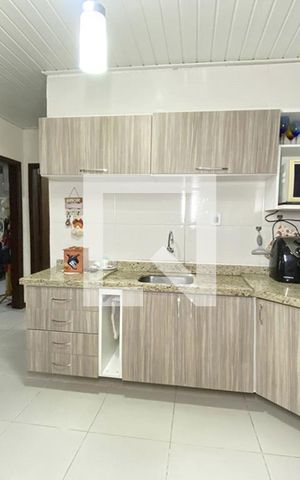 Casa à venda com 98m², 2 quartos e 2 vagasCozinha e Área de Serviço