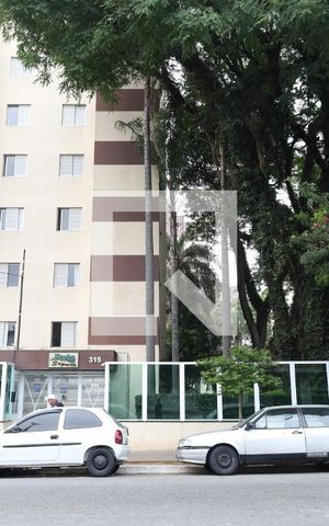 Apartamento à venda com 56m², 2 quartos e 1 vagaFachada do condomínio - Placa instalada