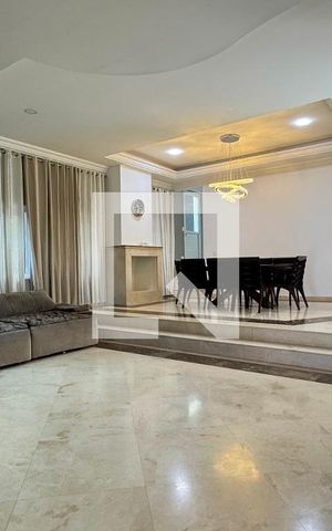 Casa de condomínio à venda com 403m², 4 quartos e 4 vagasSala
