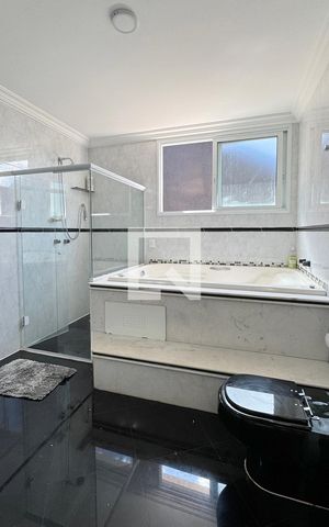 Casa de condomínio à venda com 403m², 4 quartos e 4 vagasBanheiro da Suíte 1