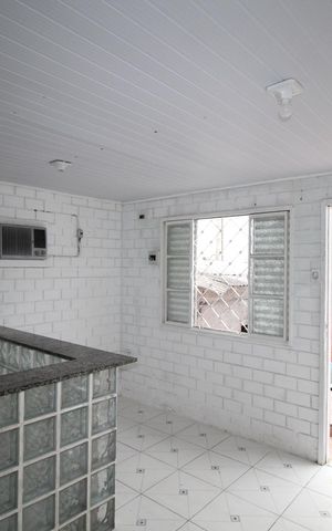 Casa à venda com 52m², 2 quartos e 2 vagasSala/Cozinha