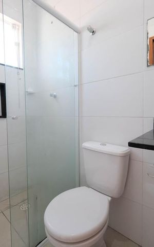 Casa de condomínio à venda com 83m², 2 quartos e 2 vagasBanheiro da Suíte 1